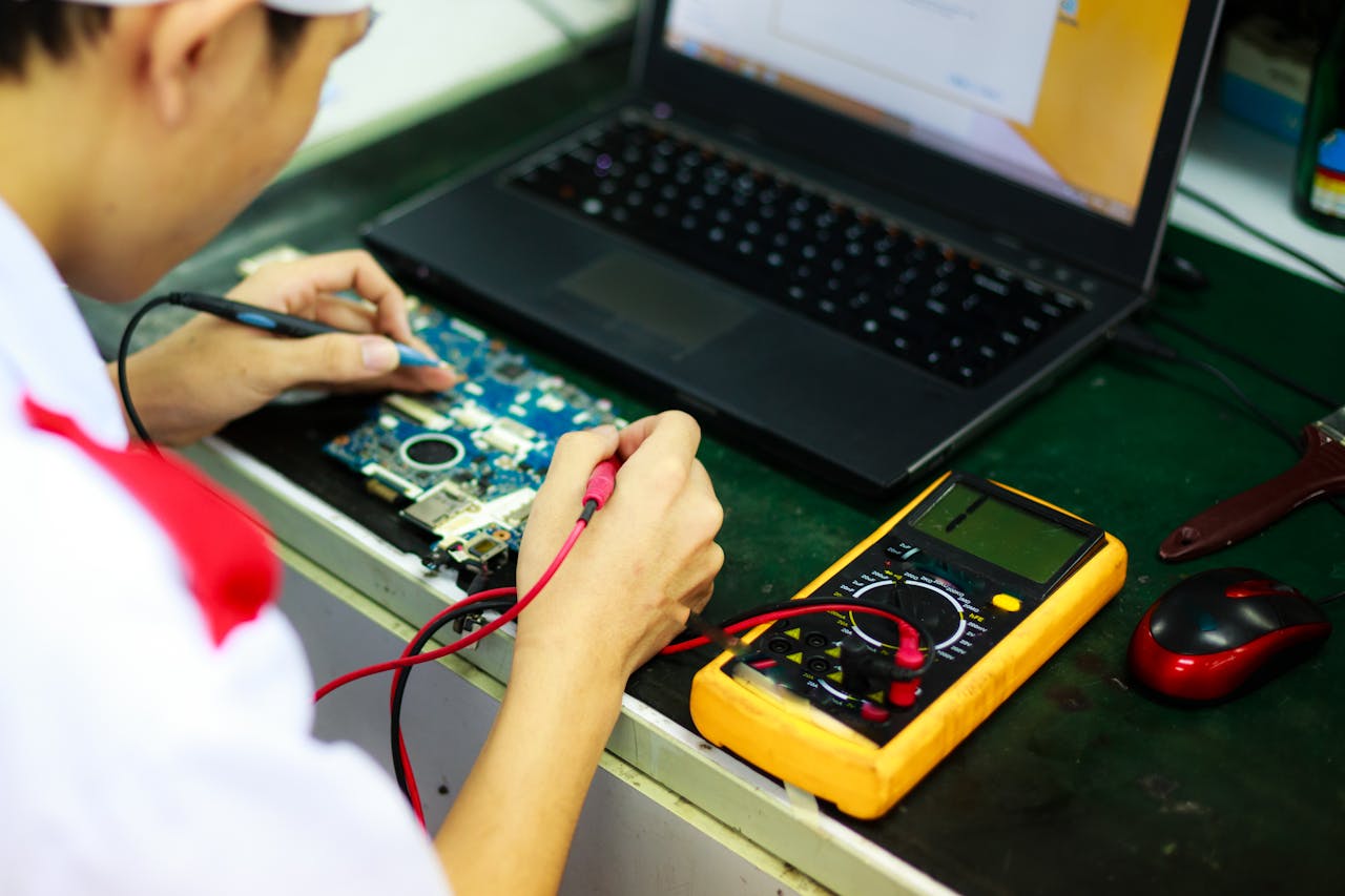 Man Soldering a Circuit Board